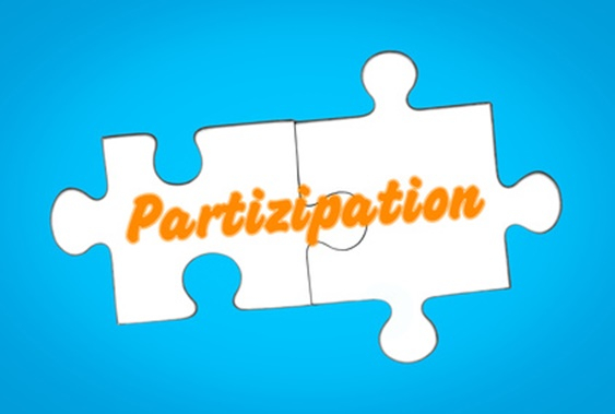 Zwei Puzzleteile ergeben das Wort participation
